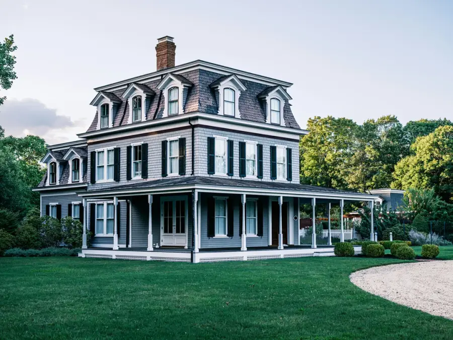 Second Empire house with mansard roof and wraparound porch, iconic heritage architecture typical of Quebec and the northeastern United States