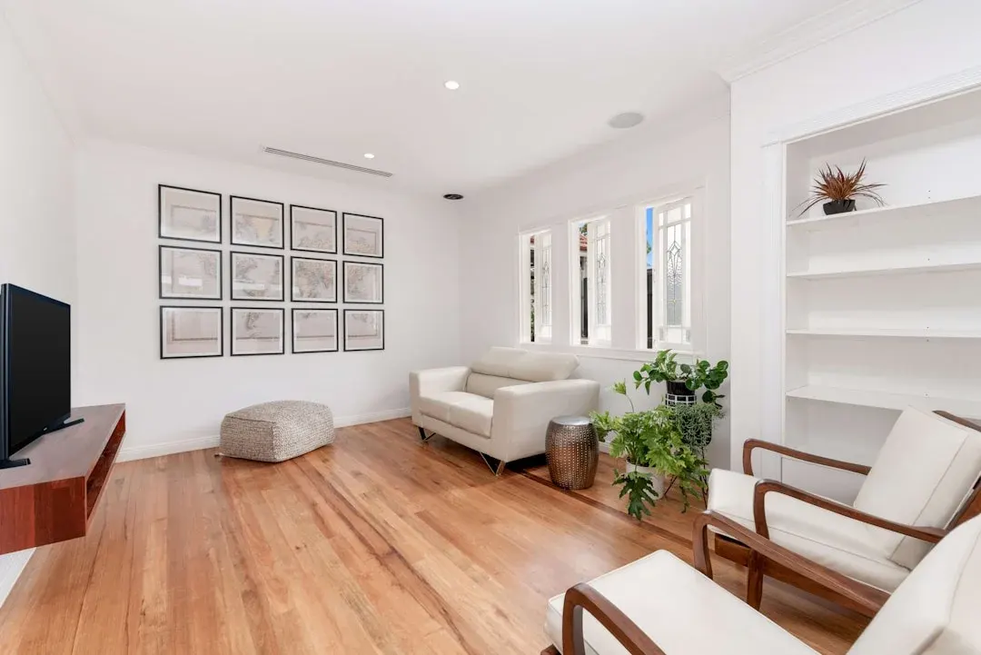 Bright renovated living room with beautiful wood floors and natural light