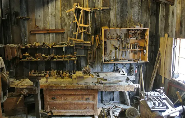 Vintage woodworking workshop with antique hand tools, the craft behind heritage wood restoration